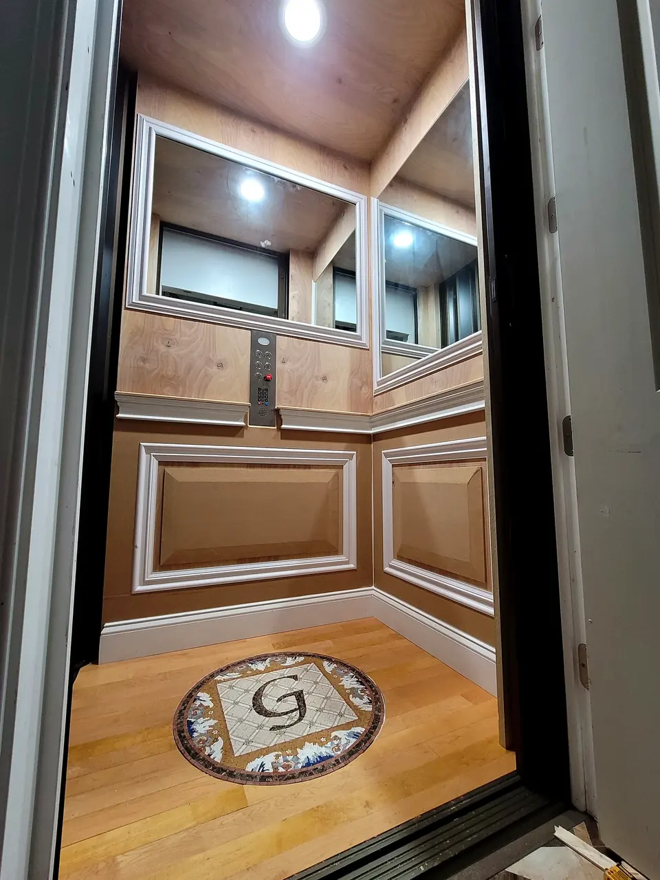Wood-paneled interior niche with finished trim